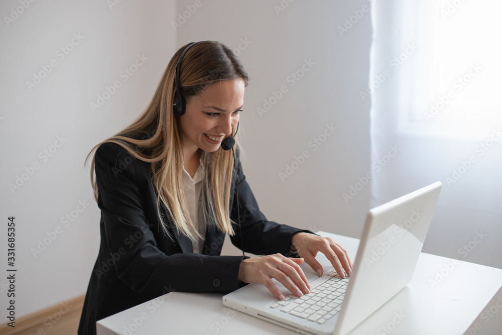 Young woman working in call center. Customer support woman in office Young woman working in call center. Customer support woman in office