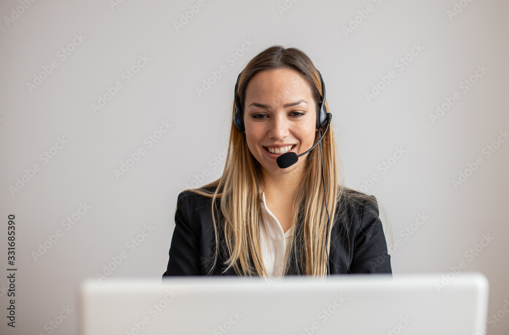 Young woman working in call center. Customer support woman in office Young woman working in call center. Customer support woman in office