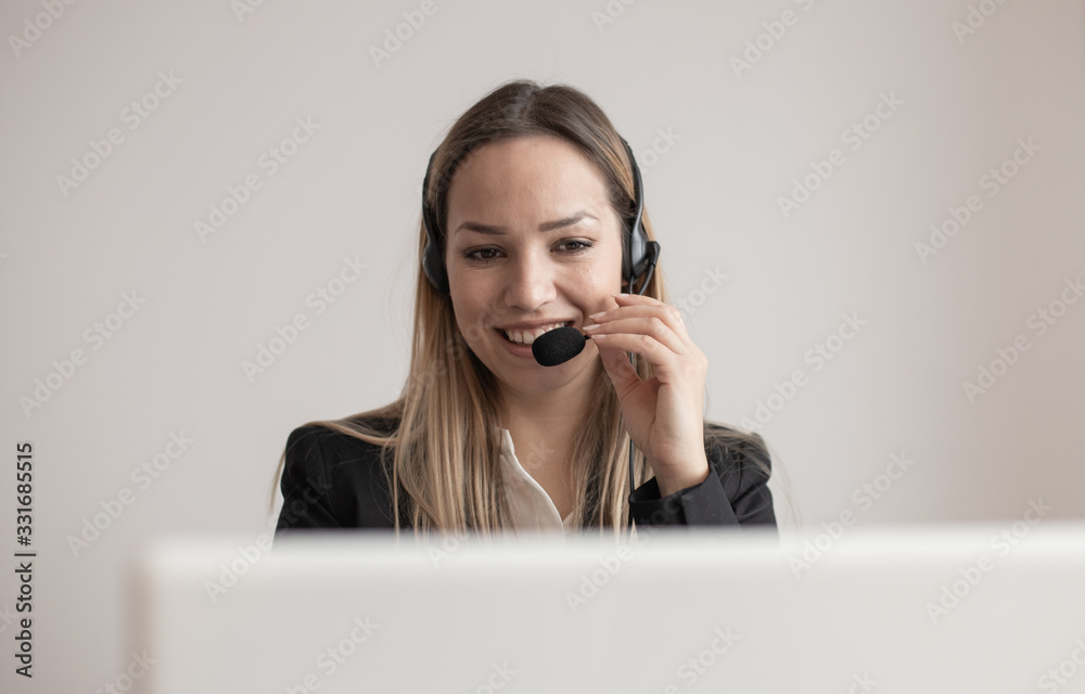 Young woman working in call center. Customer support woman in office Young woman working in call center. Customer support woman in office