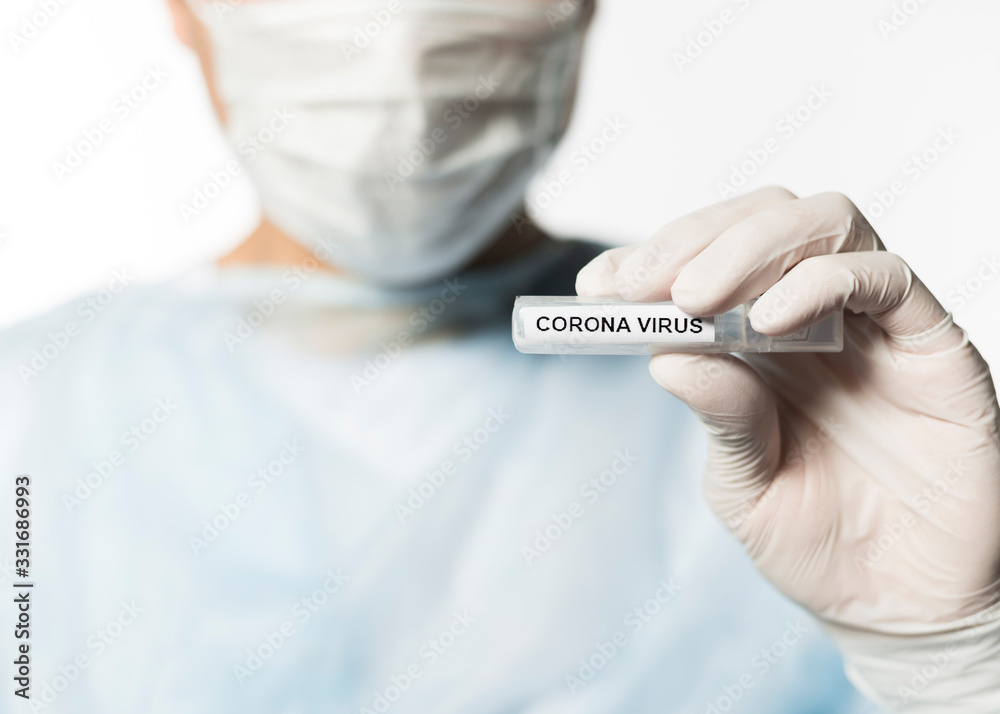 Front view of doctor holding tube with coronavirus Front view of doctor holding tube with coronavirus