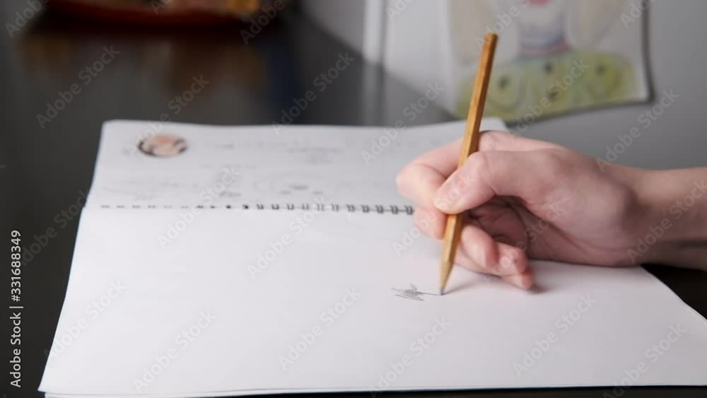 The artist at work draws. Close up. Side view.Selective soft focus. Blurred background