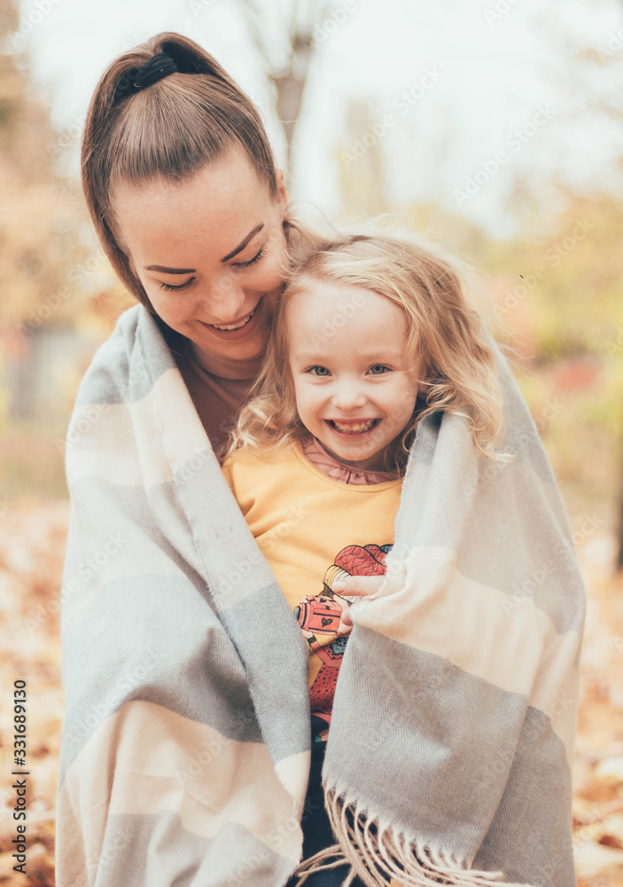 mother with daughter,mom and daughter on a picnic, family picnic,mom and daughter are playing in the park,mom hugs daughter,manifestation of mother’s love mother with daughter,mom and daughter on a picnic, family picnic,mom and daughter are playing in the park,mom hugs daughter,manifestation of mother’s love