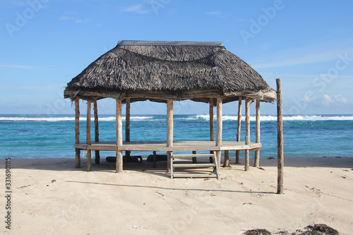 Beach fale, a simple open 'hut' (faleo'o Samoan language), popular in budget eco-tourism in Samoa. Beautiful day fale at Lalomanu Beach © peacefoo