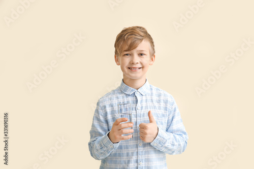 Cute little boy with glass ...
