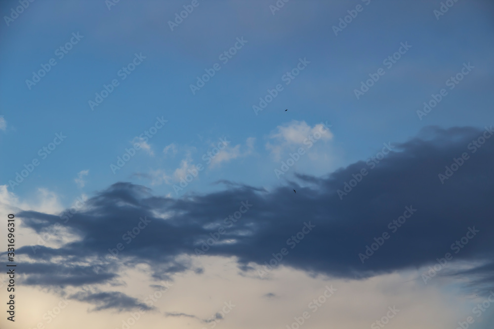 Cloud in the blue sky. A beautiful clouds against the blue sky background. Beautiful cloud pattern in the sky. Cloud in the blue sky. A beautiful clouds against the blue sky background. Beautiful cloud pattern in the sky.