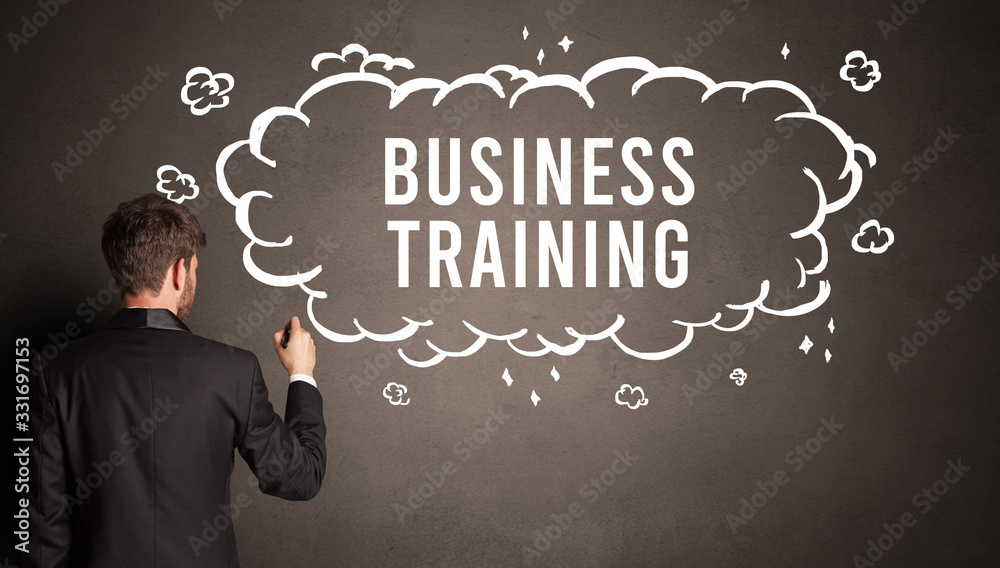 businessman drawing a cloud with BUSINESS TRAINING inscription inside, modern business concept businessman drawing a cloud with BUSINESS TRAINING inscription inside, modern business concept