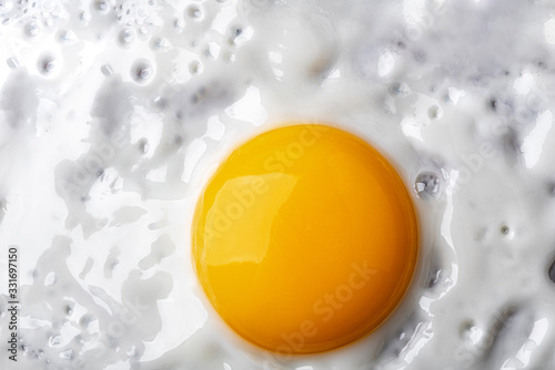 Macro photo background of close-up fried egg