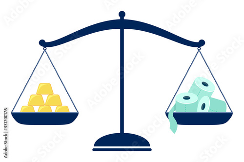 Balance scales with gold bars and toilet paper, during the corona virus situation toilet roll has become more valuable