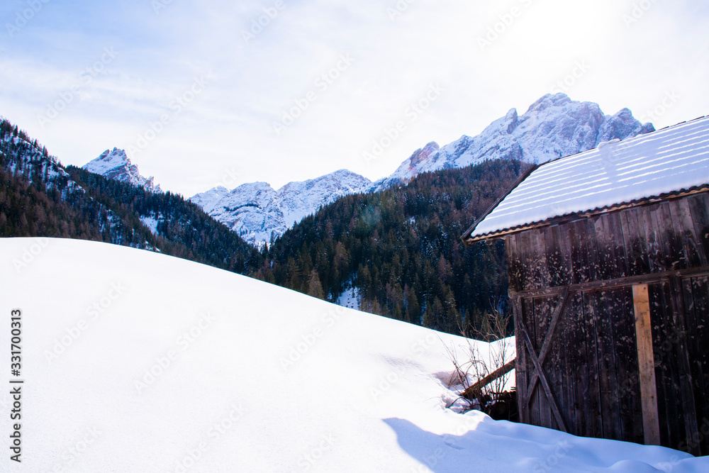 snow, hut and dolomites