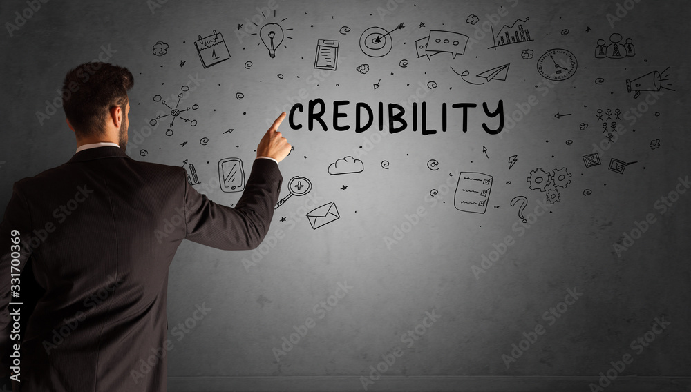 businessman drawing a creative idea sketch with CREDIBILITY inscription, business strategy concept businessman drawing a creative idea sketch with CREDIBILITY inscription, business strategy concept