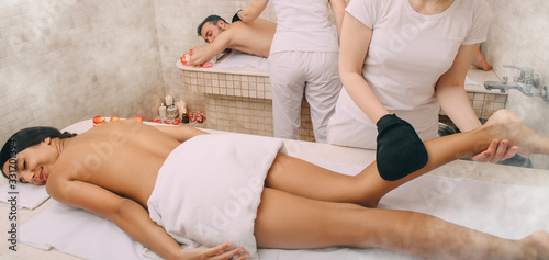 Hammam worker peels a beautiful woman's legs. Her boyfriend gets a peeling procedure with Kese gloves