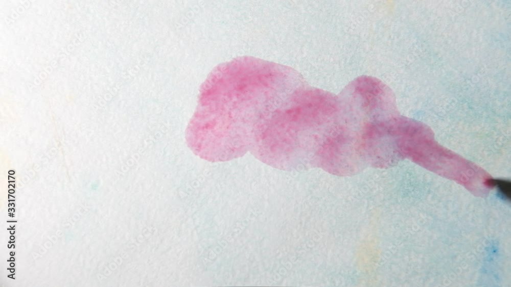 Draw rainbow colored water colors. Close up. The view from the top