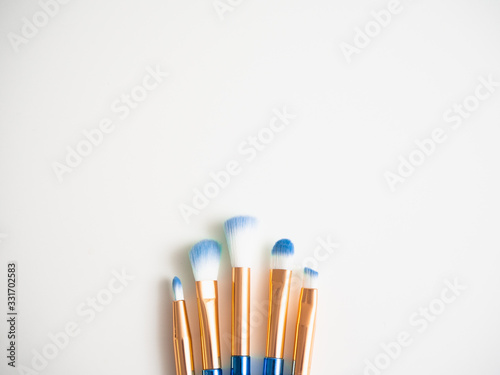 Classic blue eyeshadow brushes isolated on white background with space for copy space.