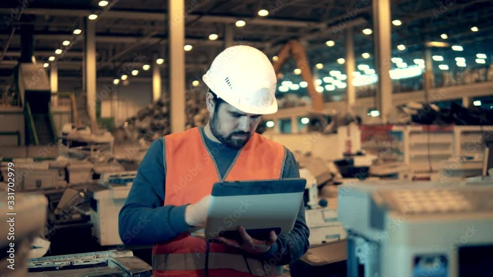 Industrial worker in a unit with defective office machines Industrial worker in a unit with defective office machines