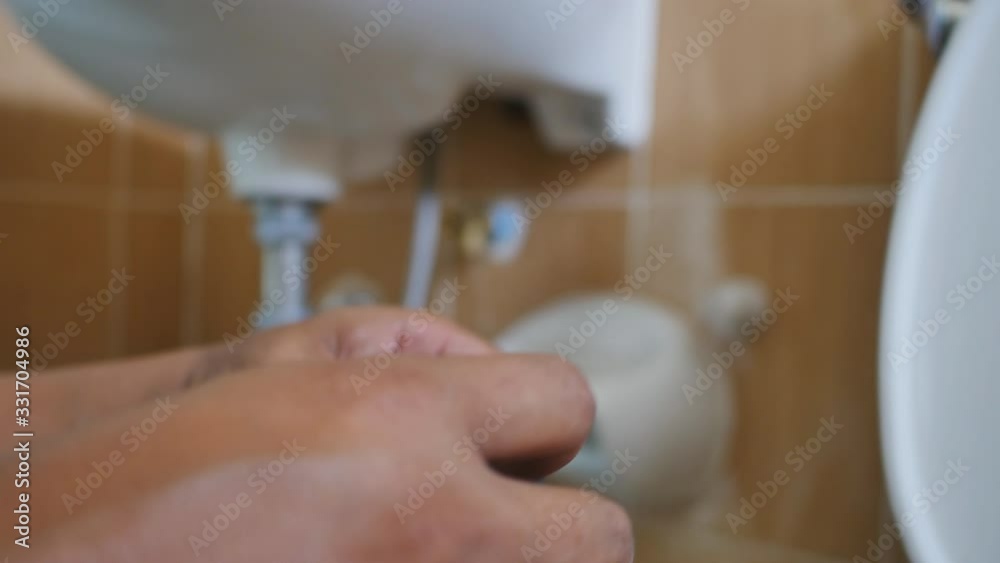 The plumber is assembling the water pipes by connecting the water pipes in addition to the existing ones. The plumber is assembling the water pipes by connecting the water pipes in addition to the existing ones.