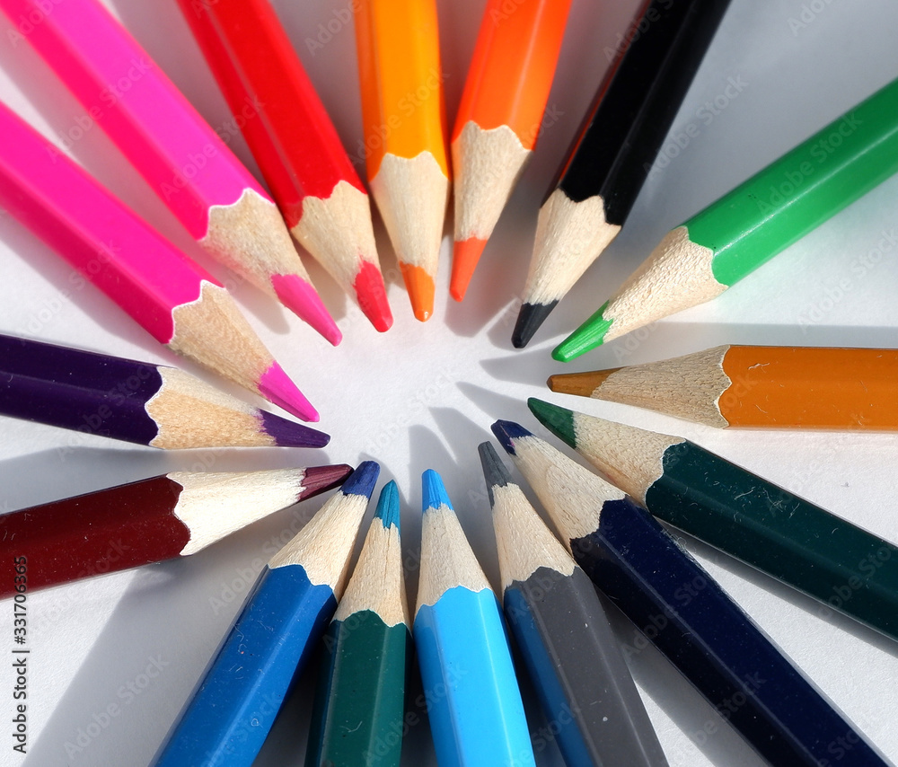 A set of colored pencils on a white background. School supplies.