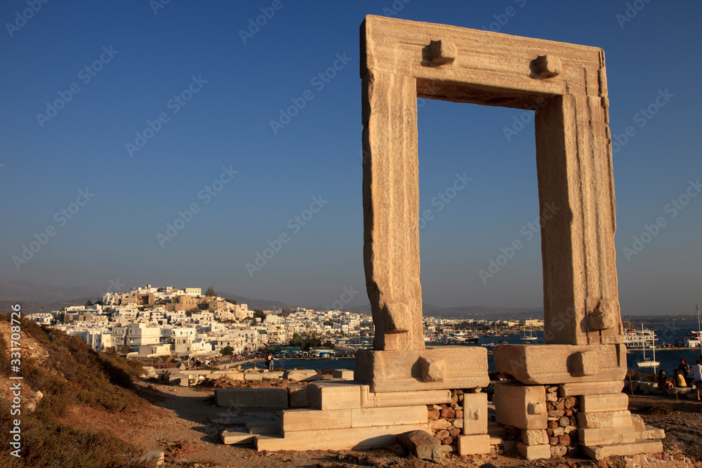 Naxos Town, Naxos / Greece - August 23, 2014: Gate of the temple of Apollo, Portara, Naxos Town, Naxos, Cyclades Islands, Greece