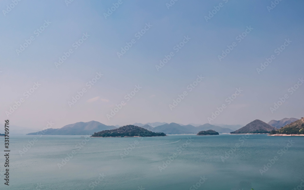 Mountains in the middle of the river and blue sky