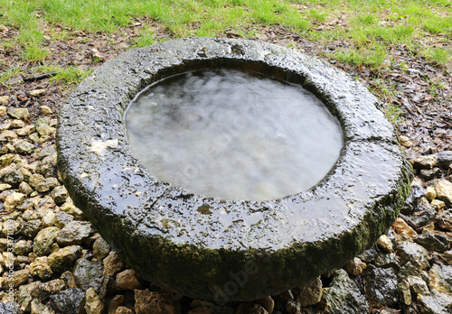 ancient basin dug in the rock to collect rainwater and for relig © ChiccoDodiFC