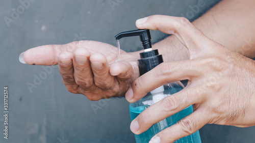 Slika na platnu Female hands using wash hand sanitizer gel