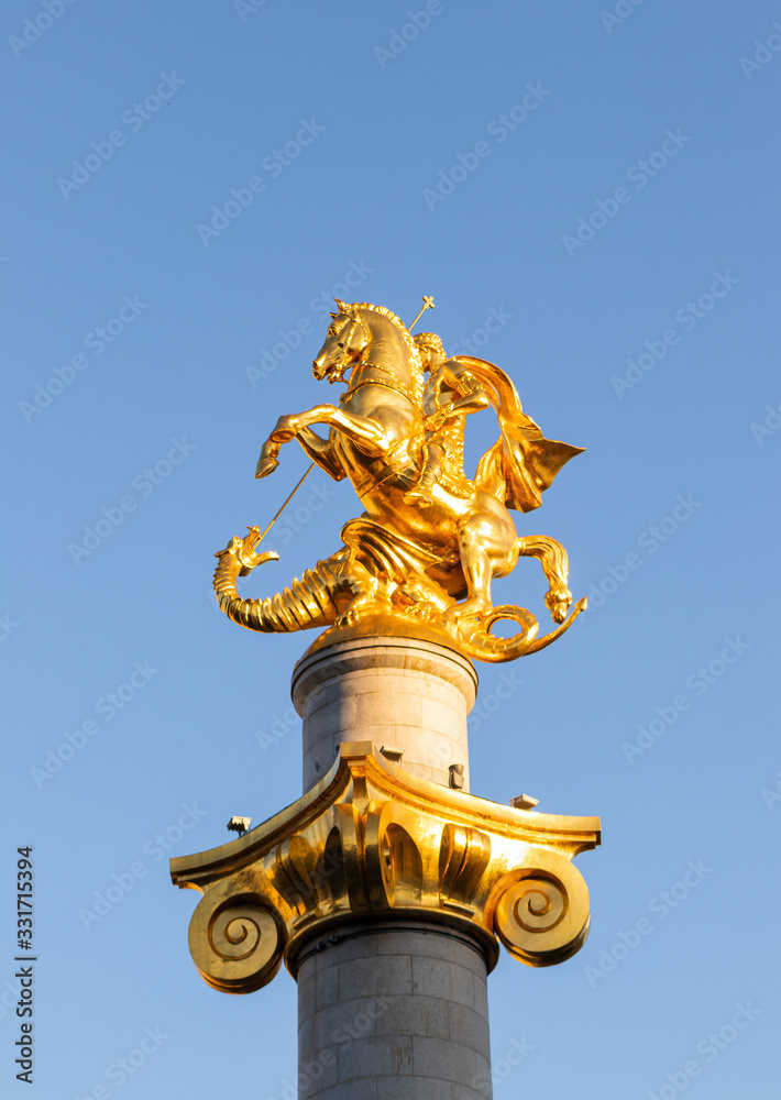 Fototapeta premium Freedom Monument created by Zurab Tsereteli - a monument that depicts St. George killing a dragon in Tbilisi city in Georgia