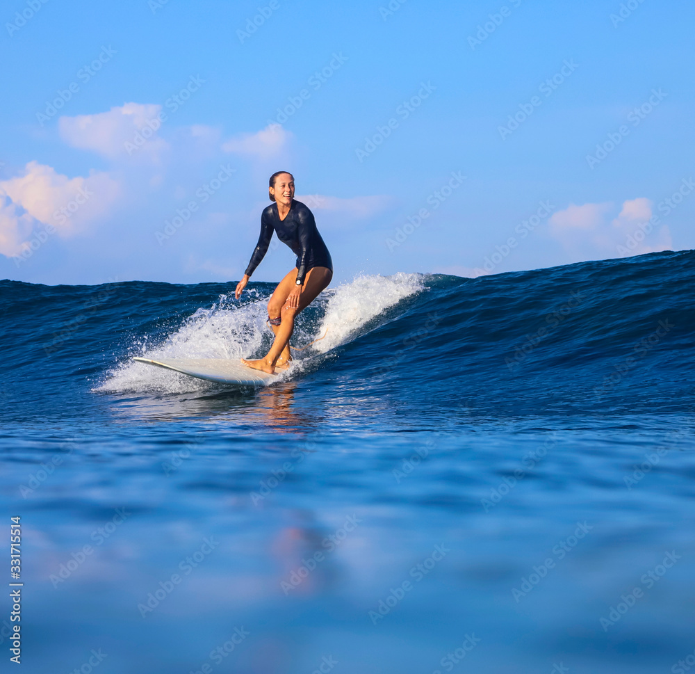 Female surfer on a wave