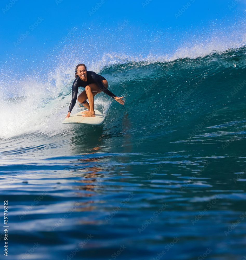 Female surfer on a wave