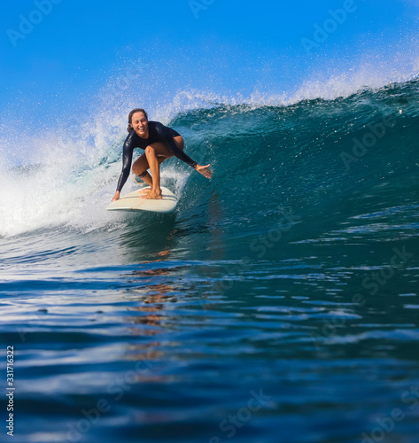 Female surfer on a wave