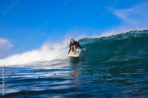 Female surfer on a wave