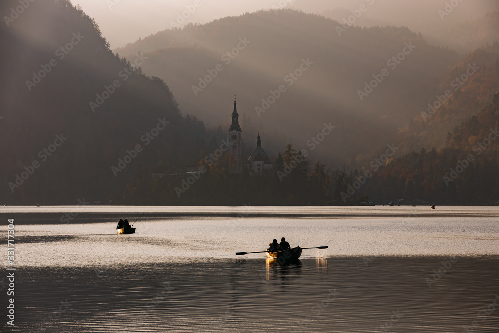 Afternoon lights at Bled Lake, Slovenia, Europe. St. Martin church in the background.