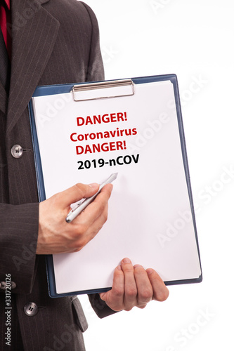 Businessman show coronavirus text