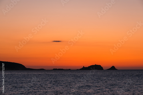 Sunset over red rock of Ile Rousse in Corsica © Jon Ingall