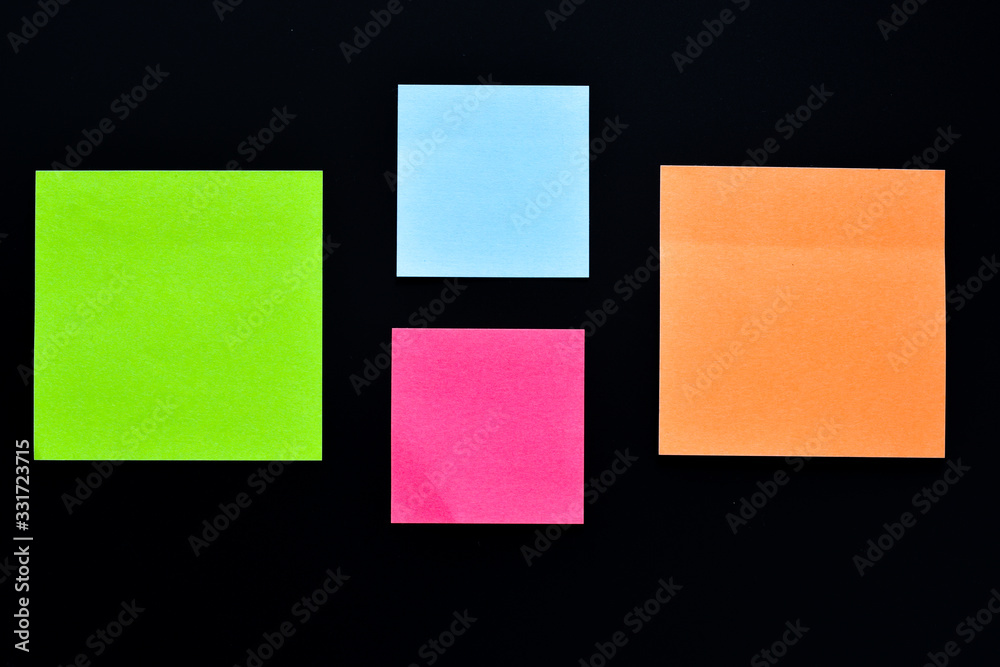 Fototapeta premium Four post its on black background