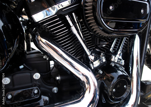 Close up view of a shiny motorcycle engine.