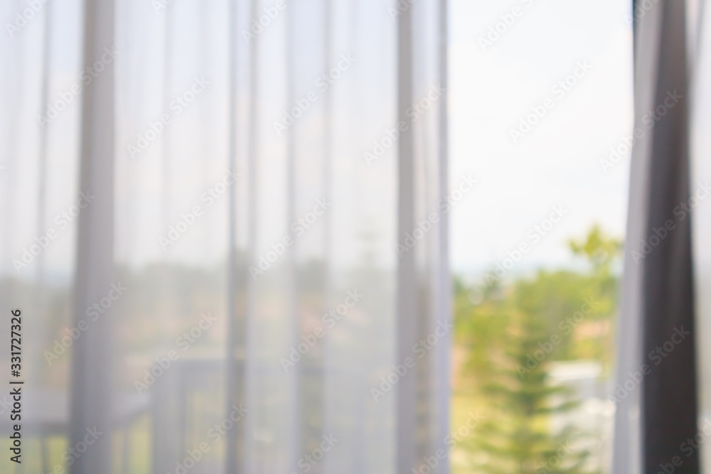 Fototapeta premium window curtain with green garden abstract blur background