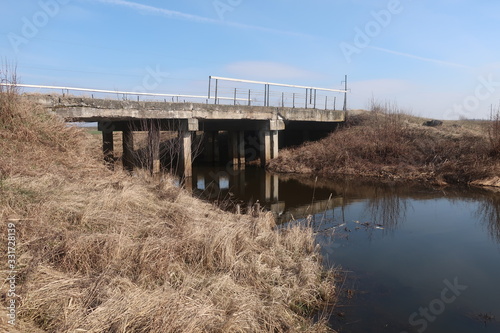  bridge over a small river against a blue sky