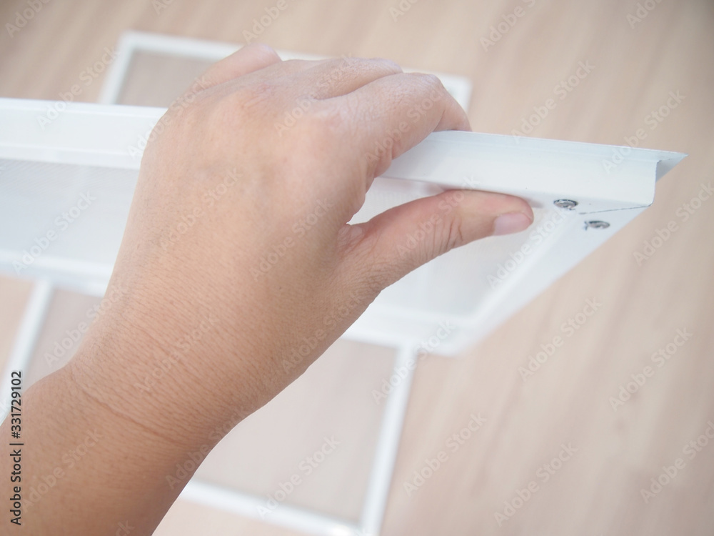 Installing mosquito wire screen interior for insect protection made from aluminium with translucent and airy as well, Suitable for home in the city concept. Installing mosquito wire screen interior for insect protection made from aluminium with translucent and airy as well, Suitable for home in the city concept.