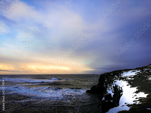 Sunset Over the Atlantic Ocean in Iceland photo