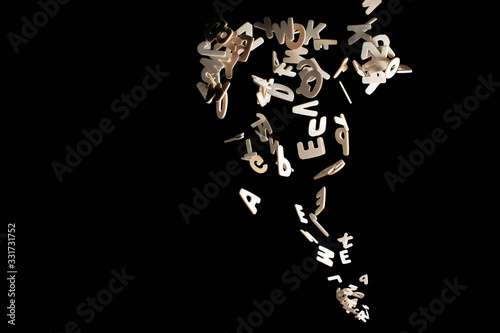 Real Wood Letters Flying away Isolated on Black Background