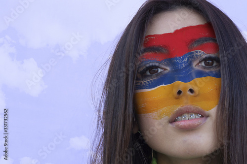 Cuadro en lienzo Flag of Armenia painted on a face of a smiling armenian young woman