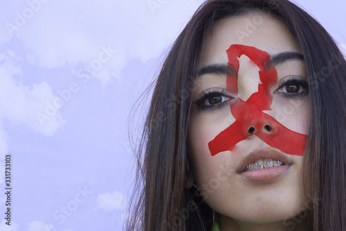 Flag of sida painted on a face of a smiling happy young woman. Copyspace.