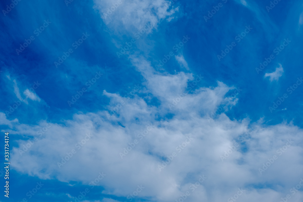 Fototapeta premium blue sky horizontal with beautiful puffy fluffy clouds with sunlight, abstract nature background