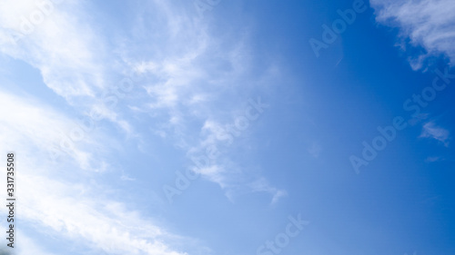 blue sky horizontal with beautiful puffy fluffy clouds with sunlight  abstract nature background