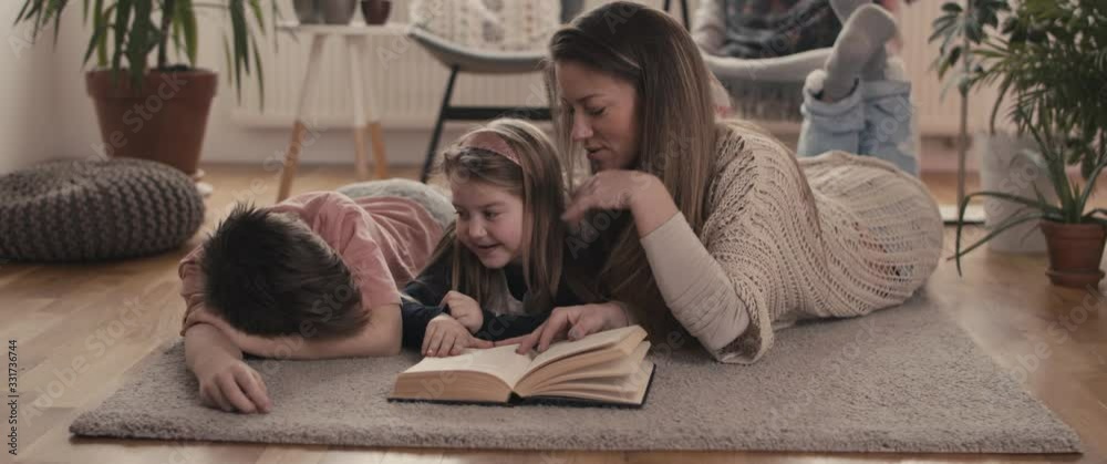 Mother daughter son reading stay home social distancing containment self isolate quarantine coronavirus