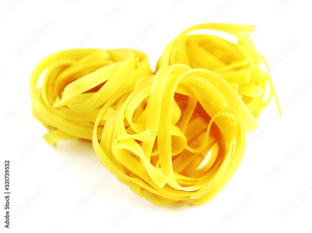 Golden round macaroni on a white background Golden round macaroni on a white background