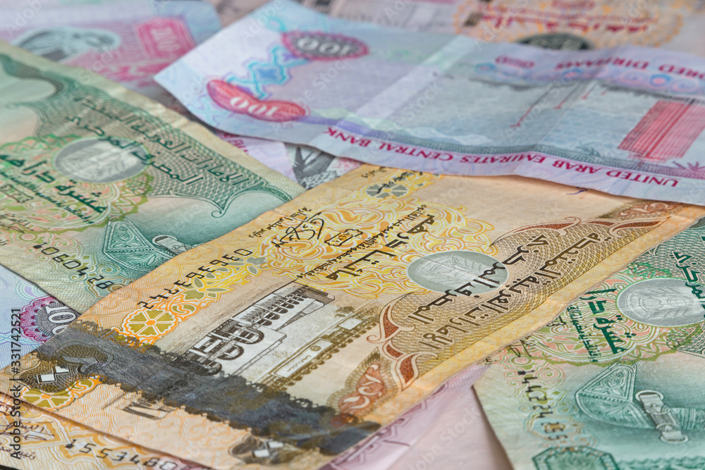 currency of United arab Emirates: heap of dirhams banknotes currency of United arab Emirates: heap of dirhams banknotes