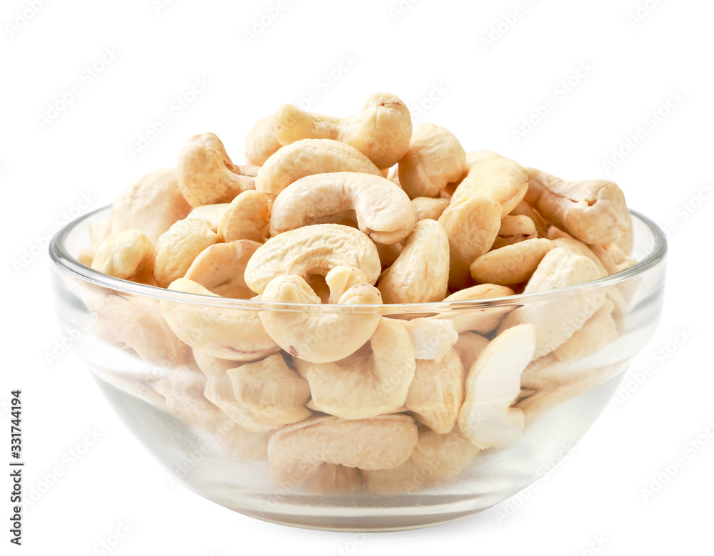 Cashew nuts in a glass plate on a white background. Isolated