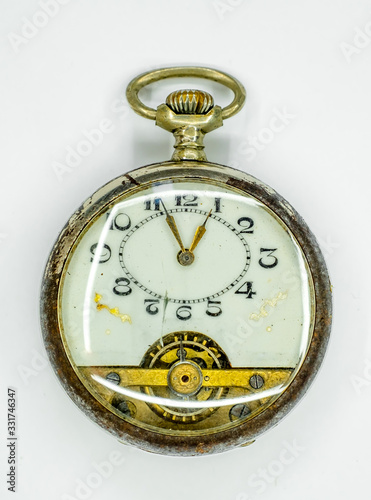 Antique pocket watch on a white background