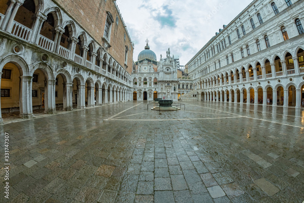 VENICE, ITALY - August 02, 2019: Courtyard of Doge s Palace - Palazzo Ducale afternoon after gentle rain