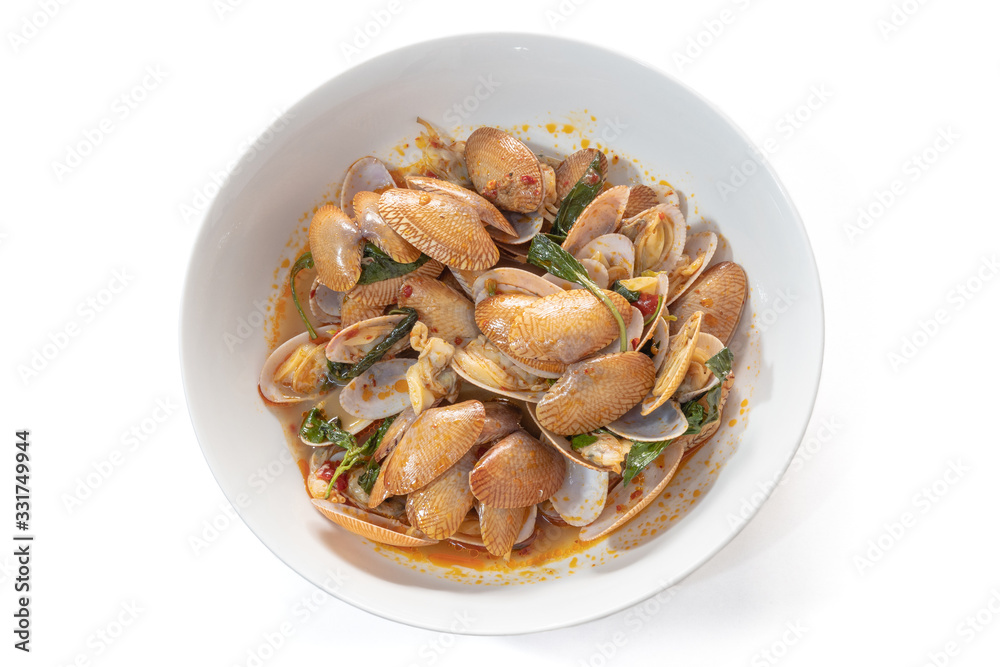 The close up of Thai Stir Fried Clams with Roasted Chili Paste on white bowl. The close up of Thai Stir Fried Clams with Roasted Chili Paste on white bowl.